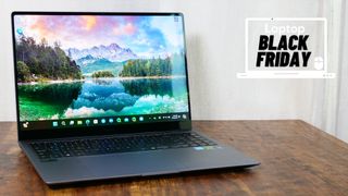 Samsung Galaxy Book 4 Ultra on a wooden table open and facing the camera with a Black Friday deals banner in the upper-right corner.