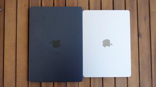 MacBook Air 15-inch M3 next to MacBook Air 13-inch M3 on a side table