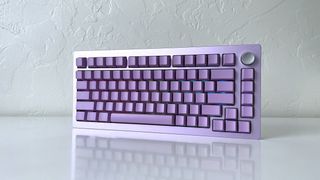 The Epomaker Tide 75 mechanical keyboard in lavender purple on a white table